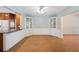 Bright dining area with built-in cabinets, white trim, and unique parquet wood flooring at 961 Oleander Se Dr, Winter Haven, FL 33880