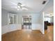 Spacious dining room featuring parquet floors, built-in display cabinets, and airy ambiance at 961 Oleander Se Dr, Winter Haven, FL 33880