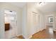 Hallway leading to bathroom and room with closets on the right at 961 Oleander Se Dr, Winter Haven, FL 33880