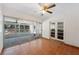 Bright sunroom with tile floors, sliding glass doors leading to the pool area, and ceiling fan at 961 Oleander Se Dr, Winter Haven, FL 33880