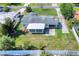 Aerial view of a single-story home with a spacious yard and white fence at 961 Piedmont Se Dr, Winter Haven, FL 33880
