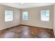 This bedroom is bright with three windows and unique tiled floor at 961 Piedmont Se Dr, Winter Haven, FL 33880