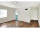 Bright bedroom with tile flooring with an access to the bathroom and a closet at 961 Piedmont Se Dr, Winter Haven, FL 33880