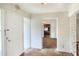 Front entrance to home with tile flooring leading to open living spaces and a view into the kitchen at 961 Piedmont Se Dr, Winter Haven, FL 33880