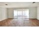 The living room has sliding glass doors to a sunroom, allowing ample natural light to flood the space at 961 Piedmont Se Dr, Winter Haven, FL 33880