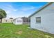 Backyard with a storage shed and screened pool enclosure at 109 Dakota Ave, St Cloud, FL 34769