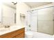 Bathroom features shower-tub combination with swan design on shower door at 109 Dakota Ave, St Cloud, FL 34769