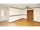 Spacious bedroom featuring hardwood floors, ceiling fan, and ample closet storage at 109 Dakota Ave, St Cloud, FL 34769
