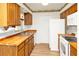 Functional kitchen with wooden countertops, white appliances, and ample storage at 109 Dakota Ave, St Cloud, FL 34769