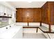 This laundry room features built-in cabinets, a window, and includes a washer and dryer at 109 Dakota Ave, St Cloud, FL 34769