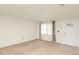 The living room has carpeted floors, a front door, and a large window at 109 Dakota Ave, St Cloud, FL 34769