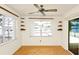 Cozy sunroom with ceiling fan, built in shelves and sliding doors leading to pool area at 109 Dakota Ave, St Cloud, FL 34769