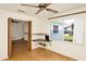 Sunroom with backyard pool view, ceiling fan, and built-in shelving for extra storage at 109 Dakota Ave, St Cloud, FL 34769