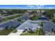 Aerial view of home showing the backyard pool and large backyard area at 114 Belmont Dr, Winter Haven, FL 33884