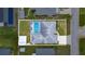 Aerial view of home showcasing a screened-in pool and spacious backyard at 114 Belmont Dr, Winter Haven, FL 33884