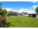 Large, well-manicured backyard with screened pool and shed at 114 Belmont Dr, Winter Haven, FL 33884