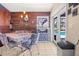 Dining room features a unique wood wall and direct access to the inviting outdoor pool area at 114 Belmont Dr, Winter Haven, FL 33884