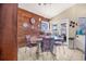 Charming dining area with stylish wood-paneled wall and modern lighting fixtures for an inviting space at 114 Belmont Dr, Winter Haven, FL 33884