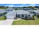 Charming single-story home with well-maintained landscaping, stone accents, and a two-car garage at 114 Belmont Dr, Winter Haven, FL 33884