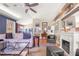 Comfortable living room with a fireplace, vaulted ceilings, and hardwood flooring at 114 Belmont Dr, Winter Haven, FL 33884