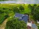 Spacious property with a beautiful home, a screened-in pool, and a serene lake view at 1256 Center St, Lake Wales, FL 33859