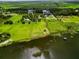 Beautiful waterfront property featuring a large green field, home, and outline of parcel at 1256 Center St, Lake Wales, FL 33859