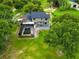 Expansive aerial view of the home, highlighting the beautiful landscaping and pool area at 1256 Center St, Lake Wales, FL 33859