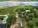 Expansive property featuring lake views, verdant pastures, and mature trees at 1256 Center St, Lake Wales, FL 33859