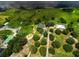 Lush property with mature trees, two dwellings, and extensive green space at 1256 Center St, Lake Wales, FL 33859