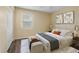 Bedroom featuring a king bed, ceiling fan, bench, and a window at 1256 Center St, Lake Wales, FL 33859