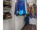 Walk-in closet with wire shelving and hanging clothes at 1256 Center St, Lake Wales, FL 33859