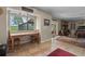 Inviting dining area with scenic views, tile flooring, and access to the spacious living room at 1256 Center St, Lake Wales, FL 33859