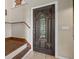 Welcoming entryway featuring a beautiful stained glass door and hardwood steps at 1256 Center St, Lake Wales, FL 33859