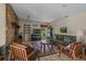 Comfortable living room with a cozy brick fireplace, plush seating, and bright natural light at 1256 Center St, Lake Wales, FL 33859