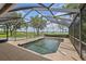 Enjoy the outdoors in this screened-in pool area, perfect for swimming and relaxation at 1256 Center St, Lake Wales, FL 33859