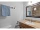 This bathroom features a granite vanity, a tile backsplash, and a framed mirror at 1273 Scrub Jay Trl, Frostproof, FL 33843