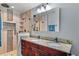 Modern bathroom with a double vanity, a walk-in shower, and stylish fixtures at 1273 Scrub Jay Trl, Frostproof, FL 33843