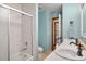 Bright bathroom featuring double sinks and a shower-tub combo at 1273 Scrub Jay Trl, Frostproof, FL 33843