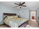 Spacious bedroom with a ceiling fan, a large window, and a comfortable bed at 1273 Scrub Jay Trl, Frostproof, FL 33843
