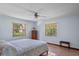 Comfortable bedroom featuring dual windows that provide ample natural light at 1273 Scrub Jay Trl, Frostproof, FL 33843