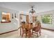 Inviting dining room with large window and view of the kitchen enhances the home's open and connected feel at 1273 Scrub Jay Trl, Frostproof, FL 33843