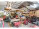 Messy garage space filled with tools and equipment, perfect for a workshop or storage area at 1273 Scrub Jay Trl, Frostproof, FL 33843