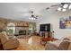Open-concept living room with hardwood floors, a stone fireplace, and recessed lighting at 1273 Scrub Jay Trl, Frostproof, FL 33843