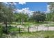 Beautiful property featuring mature trees, open fields, and gated access at 1273 Scrub Jay Trl, Frostproof, FL 33843