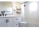 Bright bathroom with a shower and tub, storage basket, modern mirror and faucet at 1334 Highland Park S Dr, Lake Wales, FL 33898