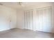 Spacious bedroom featuring two large closets and neutral-colored walls and carpet at 1334 Highland Park S Dr, Lake Wales, FL 33898