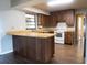 Updated kitchen with breakfast bar, stylish countertops, and modern appliances at 1334 Highland Park S Dr, Lake Wales, FL 33898