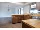 Spacious kitchen with wood cabinets, modern countertops, and stainless steel appliances at 1334 Highland Park S Dr, Lake Wales, FL 33898