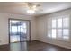 Bright living room with sliding glass doors to screen porch and a window letting in natural light at 1334 Highland Park S Dr, Lake Wales, FL 33898