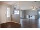 Bright living room with wood-look floors, partition wall, and ample natural light at 1334 Highland Park S Dr, Lake Wales, FL 33898